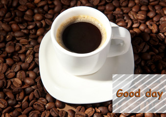 Cup of coffee on coffee beans background