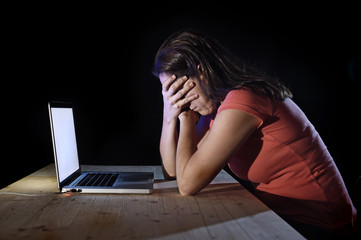 worker or student woman working computer late night in stress