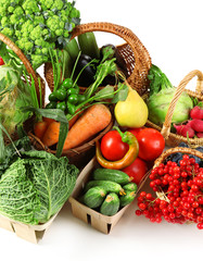 Fresh organic vegetables in wicker baskets, close up