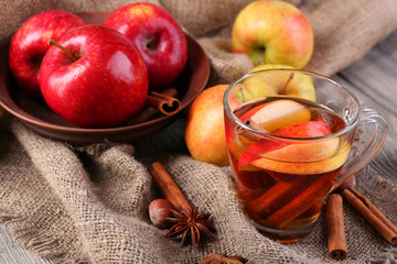 Apple cider with cinnamon sticks, spices and fresh apples