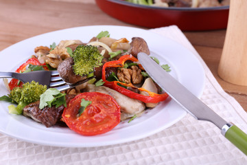 Braised wild mushrooms with vegetables and spices in pan and