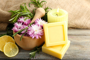 Handmade soap with the branches of rosemary, fresh flowers and