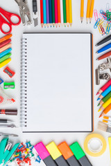 Blank notebook with colourful crayons