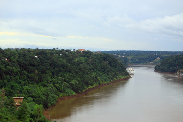 Fototapeta premium view of river Iguazu from international bridge between Brazil