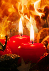 Two  Advent candles and christmas wreath.