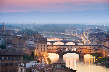 Fototapeta na wymiar Colorful sunset over Ponte Vecchio on Arno River, Florence, Ital