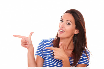 Attractive woman pointing to her right