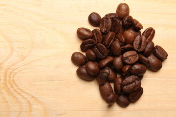 Coffee beans on wood background