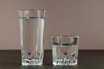 Two different height glass containing clean water