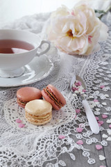 Fototapeta na wymiar Valentine's Day: Romantic tea drinking with macaroons
