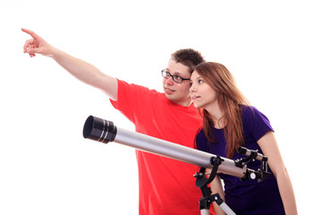 Two people observe through a telescope