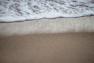 Soft wave of the sea on the sandy beach
