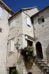 Old house in Trogir with white stone facade