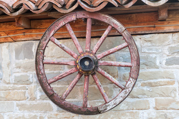Obraz premium old wagon wheel on the wall