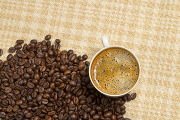 cup of coffee on linen cloth