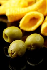 green olives on a black background