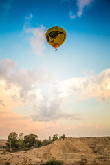 Fototapeta na wymiar yellow balloon above the earth