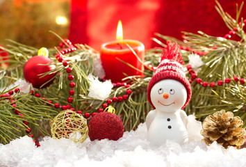 Fototapeta na wymiar Postcard with snowman and christmas decoration