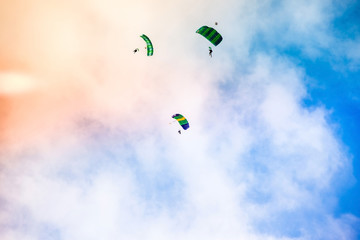 three athletes parachutist fly