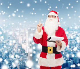 man in costume of santa claus with notepad