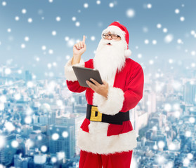 man in costume of santa claus with tablet pc