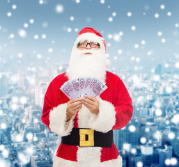 man in costume of santa claus with euro money