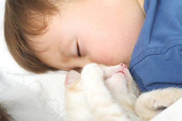 Boy and cat sleeping sweet