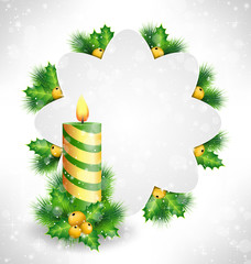 Burning Christmas candle with holly sprigs, pine branches and fr