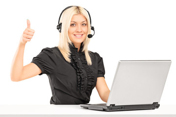 Female call service operator giving a thumb up