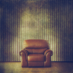 Grunge inerior with leather armchair and wallpaper