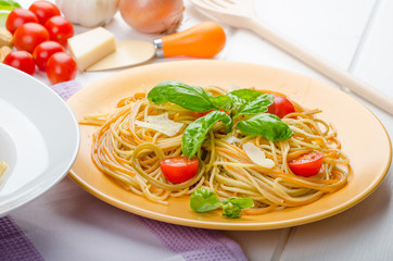 Lemon pasta with cherry tomatoes, basil and nuts