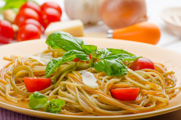Lemon pasta with cherry tomatoes, basil and nuts