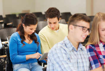 group of smiling students with tablet pc