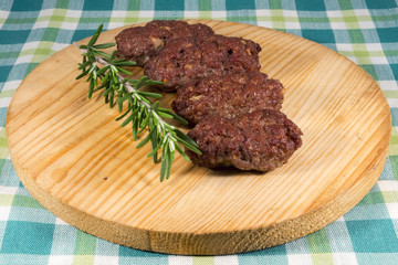 Cevapcici on a wooden dish