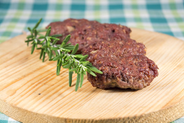 Cevapcici on a wooden dish