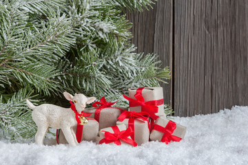 Christmas home decoration with small gifts and lamb figurine © smiltena