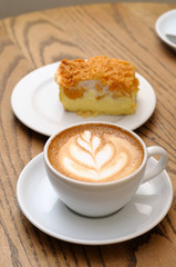 cappuccino cup with cake