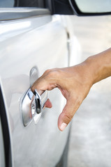 Closeup of man hand opening a car door