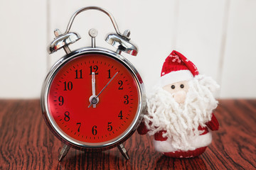 Santa Claus or Father Frost and retro alarm clock