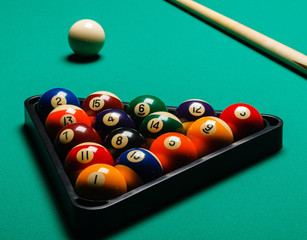 Billiard balls in a pool table.