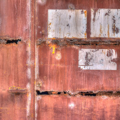 old rusty gate with signs