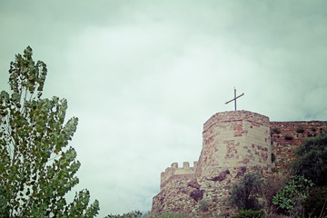 cross on an old castle