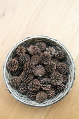 The cones ornament in woven bowl