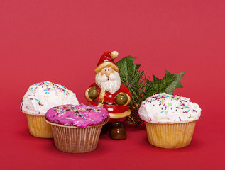 Christmas composition with Santa Claus and cupcakes