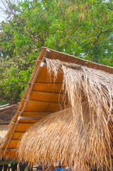 Thatched roof at the hut in the countryside of Thailand