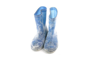 dirty rubber boots isolated on white background