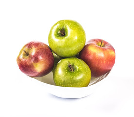 multicolored apples in a white bowl