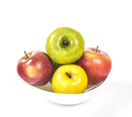 multicolored apples in a white bowl