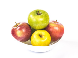 multicolored apples in a white bowl
