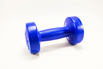 blue color dumbbell of weight training in studio